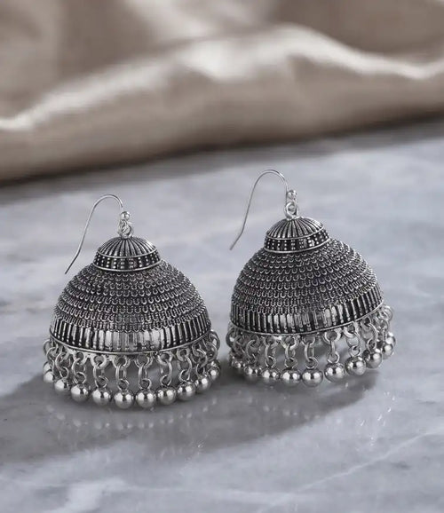 Antique oxidized silver jhumka earrings with textured dome and metallic bead drop details by Trivo Essentials