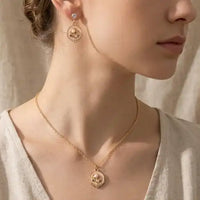 Gold plated floral enamel round pendant necklace with matching pearl moti earrings set by Trivo Essentials
