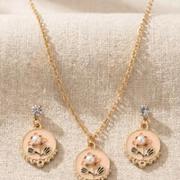 Gold plated floral enamel round pendant necklace with matching pearl moti earrings set by Trivo Essentials