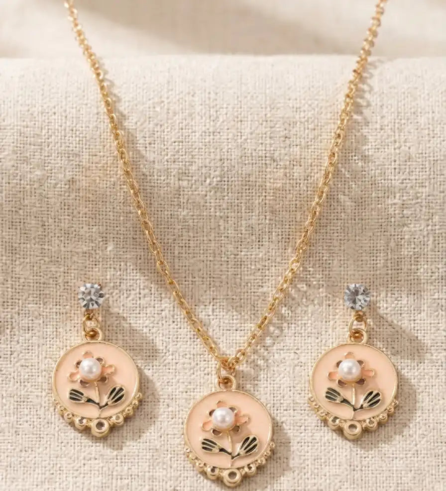 Gold plated floral enamel round pendant necklace with matching pearl moti earrings set by Trivo Essentials