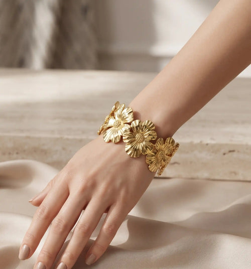 Gold plated open cuff bracelet kara featuring textured flower motifs by Trivo Essentials