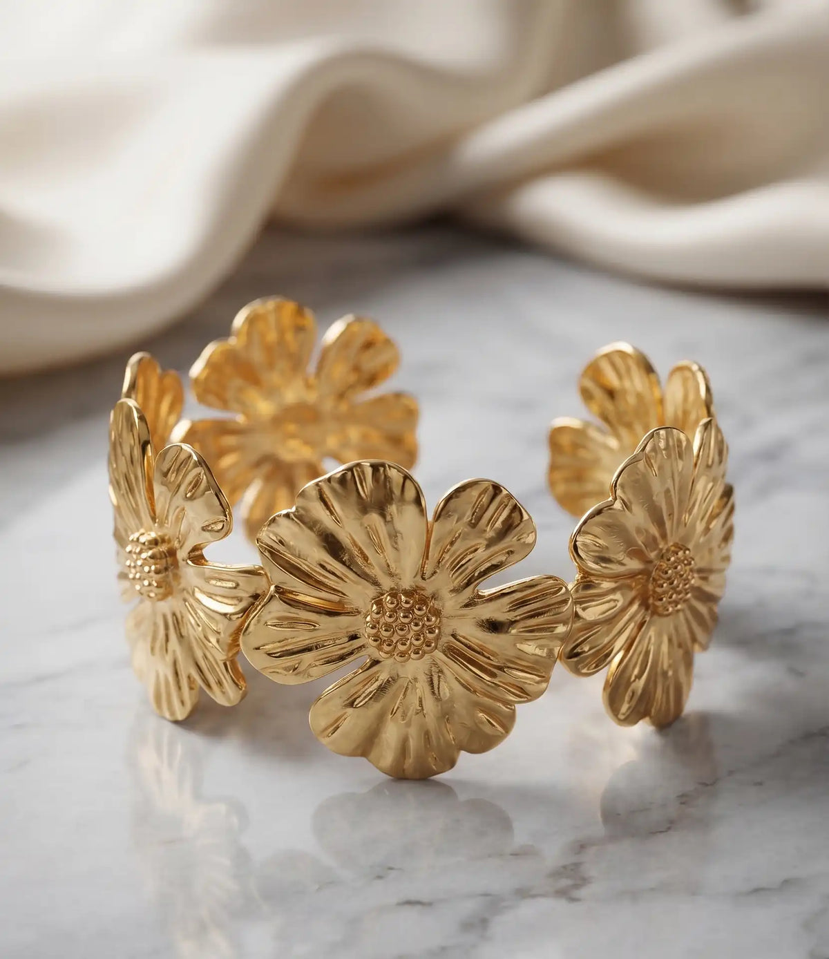 Gold plated open cuff bracelet kara featuring textured flower motifs by Trivo Essentials