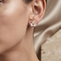 Gold plated 3-petal pearlescent iridescent flower stud earrings with center bead by Trivo Essentials