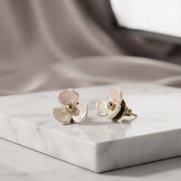 Gold plated 3-petal pearlescent iridescent flower stud earrings with center bead by Trivo Essentials