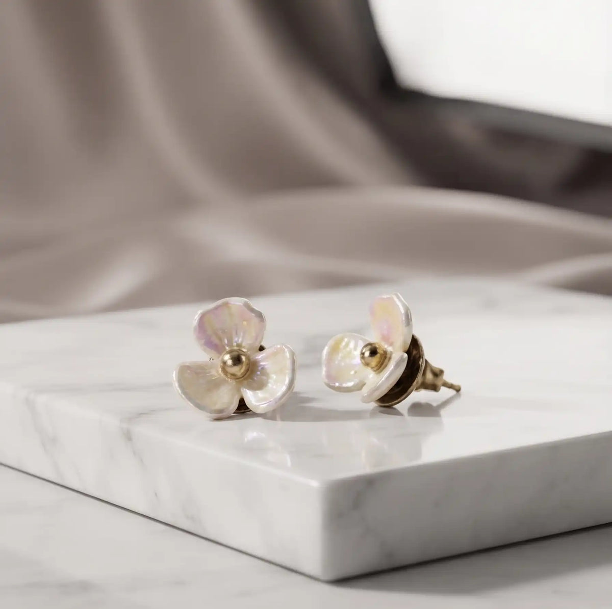Gold plated 3-petal pearlescent iridescent flower stud earrings with center bead by Trivo Essentials