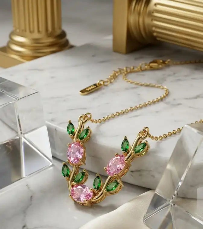 Gold plated floral vine necklace with pink zircon and emerald green leaves for women by Trivo Essentials