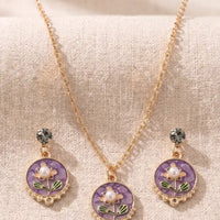 Gold plated purple floral enamel round pendant necklace with matching pearl moti earrings set by Trivo Essentials