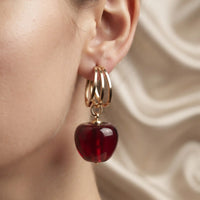 Gold plated triple hoop earrings with glossy red apple resin drop charm by Trivo Essentials