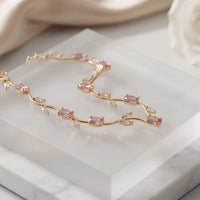 Gold plated tulip bracelet featuring oval blush pink stones and clear crystal leaf accents by Trivo Essentials