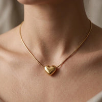 Gold plated puffed heart pendant on a sleek snake chain necklace by Trivo Essentials