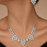 Rhodium silver plated cubic zirconia leaf motif necklace and matching drop earrings bridal set by Trivo Essentials