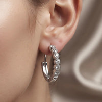 Rhodium silver huggie hoop earrings with clear cubic zirconia stone row by Trivo Essentials