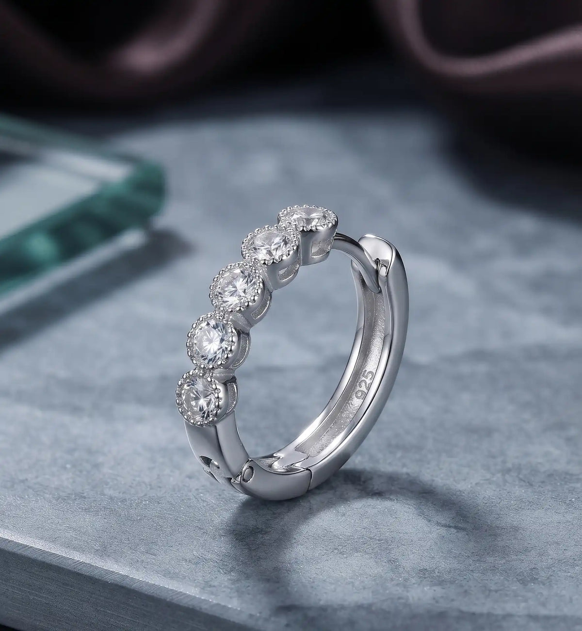 Rhodium silver huggie hoop earrings with clear cubic zirconia stone row by Trivo Essentials