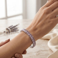 Rhodium silver plated tennis bracelet featuring rectangle emerald-cut soft pink CZ stones by Trivo Essentials