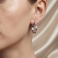 Rhodium silver huggie hoop earrings with ruby red and clear zircon stones by Trivo Essentials