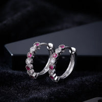Rhodium silver huggie hoop earrings with ruby red and clear zircon stones by Trivo Essentials