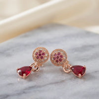Rose gold plated teardrop pear cut ruby red zircon drop leverback earrings by Trivo Essentials