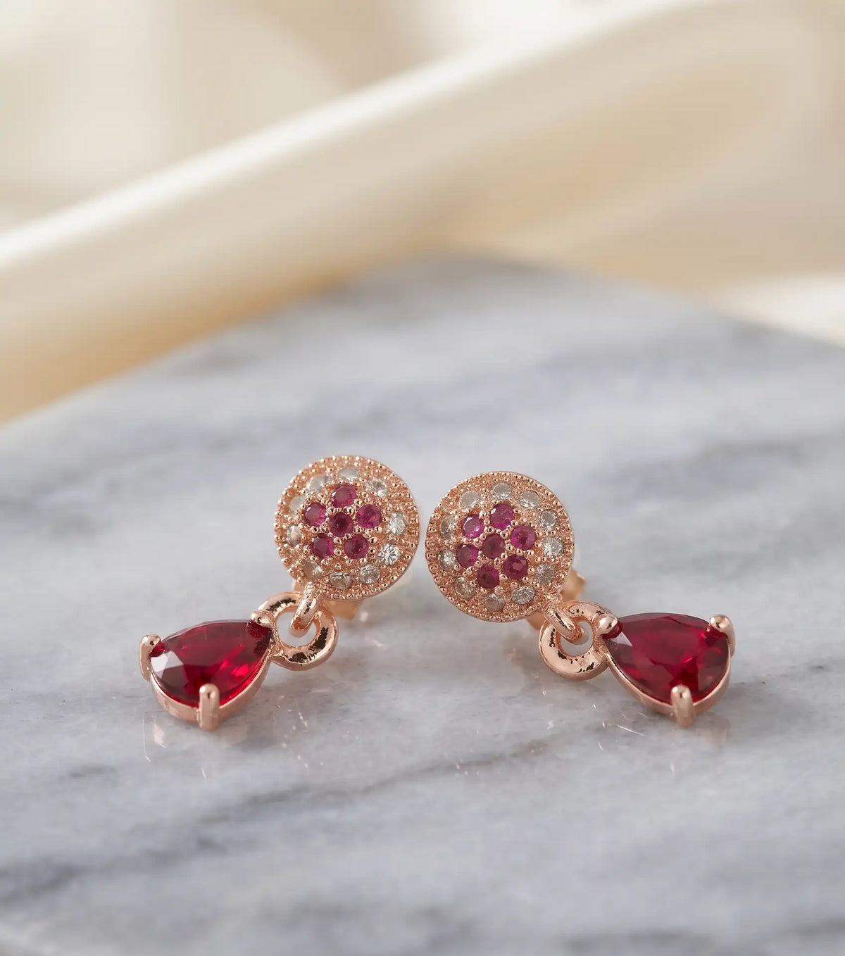 Rose gold plated teardrop pear cut ruby red zircon drop leverback earrings by Trivo Essentials