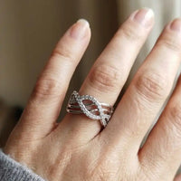 ilver plated wide criss-cross wave band ring with pave white zircons by Trivo Essentials