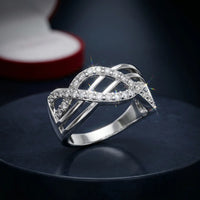 ilver plated wide criss-cross wave band ring with pave white zircons by Trivo Essentials