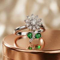 Silver plated adjustable spinning sunflower ring with pave white zircons and emerald green stone leaves by Trivo Essentials