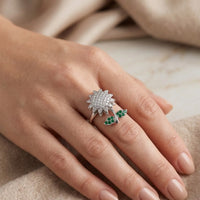 Silver plated rotating sunflower ring with pave white zircons and emerald green stone leaves by Trivo Essentials