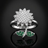 Silver plated rotating sunflower ring with pave white zircons and emerald green stone leaves by Trivo Essentials